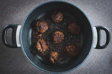 healthy plant-based food recipes concept, vegan meatballs made of black beans mushroom mince and textured vegetable protein getting pan friedの写真素材