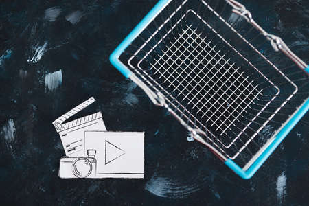 creative content sold online conceptual image, photo and video digital downloads icon in shopping basketの写真素材