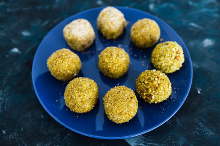 healthy plant-based food recipes concept, homemade fried vegan pesto risotto balls arancini
