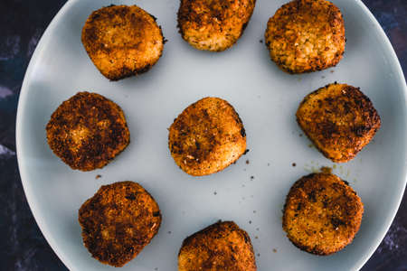 healthy plant-based food recipes concept, homemade fried vegan pesto risotto balls arancini
