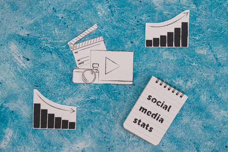 creative content and social media success conceptual image, photo and video digital content icon with stats going both up and downの写真素材