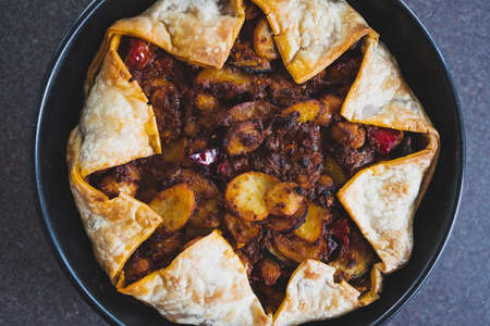 healthy plant-based food recipes concept, vegan pie with mediterranean vegetables potato and olive...