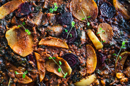 healthy plant-based food recipes concept, vegan veggie roast with potatoes beetroot and kale as main ingredientsの写真素材