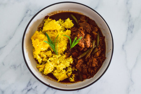 healthy plant-based food recipes concept, vegan turmeric rice and green beans stew with mock meatの写真素材