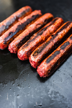 plant-based food recipes concept, vegan plant-based mock meat sausages on outdoor barbecueの写真素材