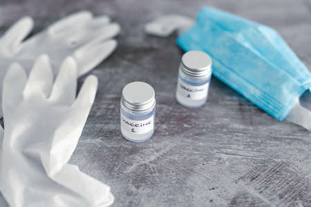 vaccine and immunisation against the pandemic, ampoules with Vaccine 1 and Vaccine 2 labels side by...