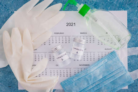 vaccine and immunisation against the pandemic, ampoules with Vaccine 1 and Vaccine 2 labels side by...