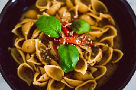 healthy plant-based food recipes, shell pasta with dairy-free mushroom sauce capsicum and basilの写真素材