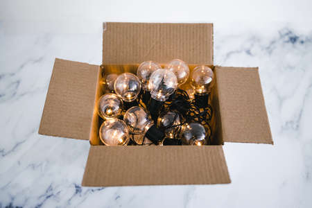 mindset and thinking outside the box concept, group of light bulbs shining from an open boxの写真素材