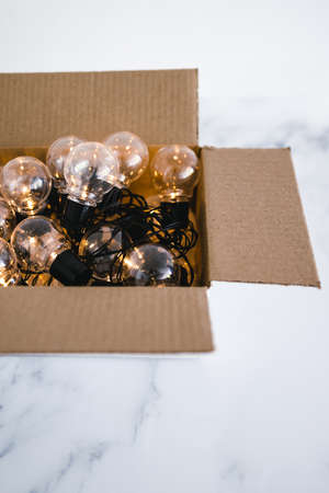 mindset and thinking outside the box concept, group of light bulbs shining from an open boxの写真素材