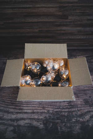 mindset and thinking outside the box concept, group of light bulbs shining from an open boxの写真素材