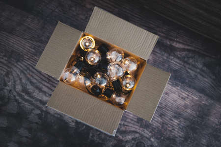 mindset and thinking outside the box concept, group of light bulbs shining from an open boxの写真素材