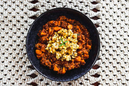 vegan pumpkin lentil and mushroom curry with truffle potato topping ,healthy plant-based food...