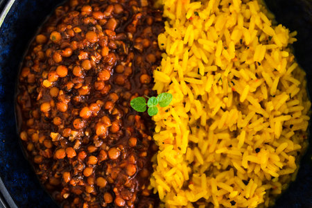 vegan spiced turmeric risotto with lentil mushroom ragout bolognaise sauce, healthy plant-based food recipesの写真素材