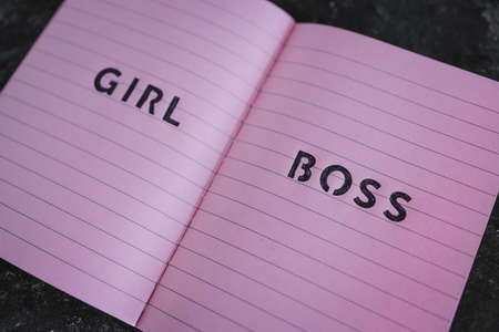 equal opportunities concept,  Girl Boss text on top of pink notebook on black backgroundの写真素材