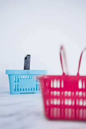 competition and retail industry conceptual image, couple of shopping baskets with different shapes...
