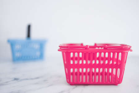 competition and retail industry conceptual image, couple of shopping baskets with different shapes...
