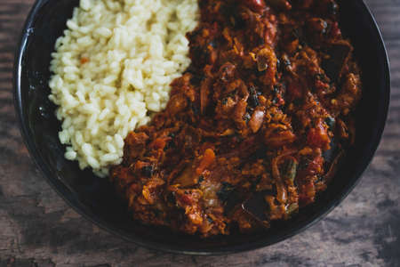 vegan aubergine spinach curry with rice,healthy plant-based food recipesの写真素材