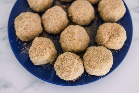 vegan arancini risotto balls about to get fried, healthy plant-based food recipesの写真素材