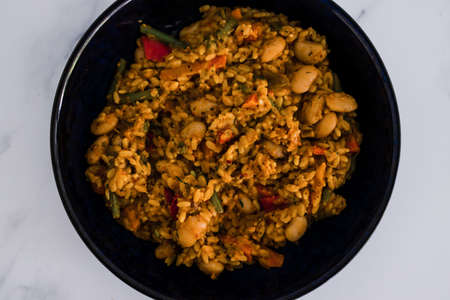 vegan sweet potato rice with autumn veggies and butter beans, healthy plant-based food recipesの写真素材
