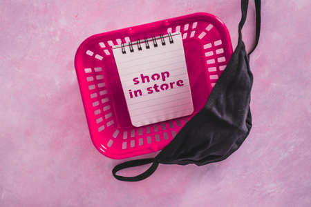 shop in store text with face mask and shopping basket, competition and retail industry recovery...