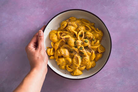 vegan mac and cheese pasta with pumpkin cashew sauce, healthy plant-based food recipesの写真素材