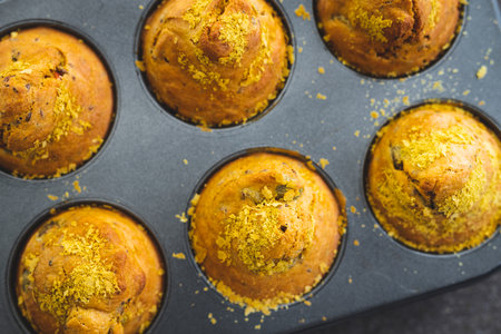 vegan savoury muffins with olives and nutritional yeast in baking tray just out of the oven, healthy...