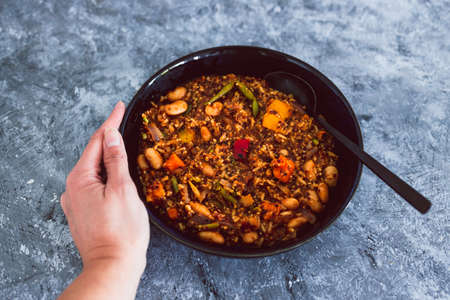vegan quinoa risotto with sweet potatoes capsicum and green beans in spicy tomato sauce, healthy...