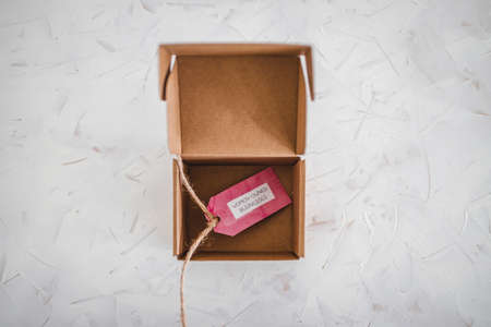women-owned businesses tag inside online order delivery parcel, supporting equality and business...