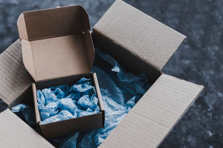 small business vs big brand metaphor with bigger and smaller delivery parcels, concept of customer behaviour and supporting small local businessesの写真素材