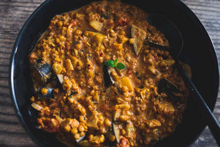 vegan eggplant lentil curry with tomato sauce and coconut milk, healthy plant-based food recipesの写真素材