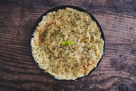 vegan lentil cottage pie with mash potato topping before going in the oven, healthy plant-based food recipesの写真素材