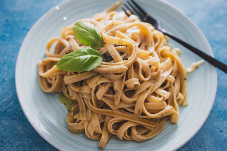vegan fettuccini pasta with lemon sauce and pepper, healthy plant-based food recipesの写真素材