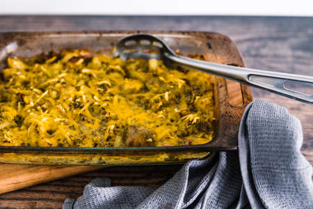 vegan oven baked smashed potatoes with pesto sauce and plant-based cheese, healthy plant-based food...