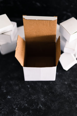 shipping industry and online shopping concept, group of white delivery parcels with one open box in...