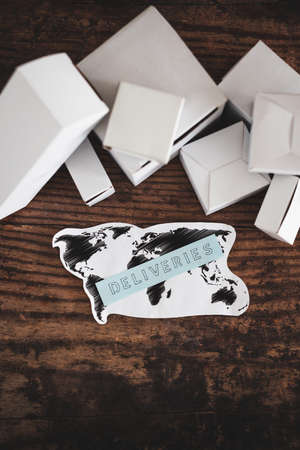 shipping industry and online shopping concept, group of white delivery parcels with world map and...