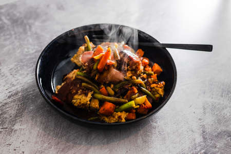 vegan roast with mixed vegetables and plant-based meatloaf slices, healthy plant-based food recipesの写真素材