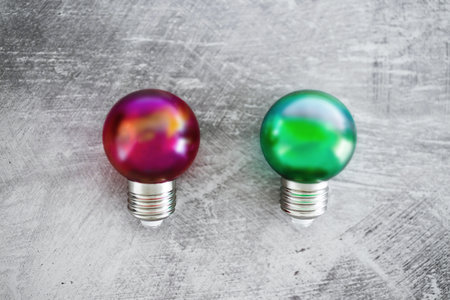 red versus green light bulb ideas, concept of brainstorming and filtering good vs bad ideasの写真素材