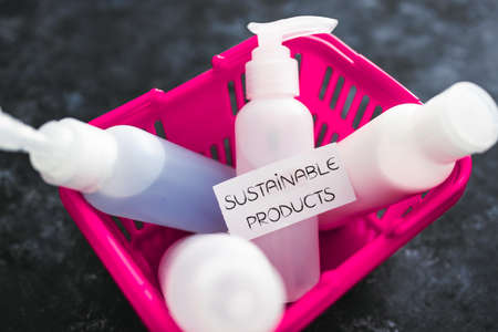 sustainable products and natural ingredients in the beauty industry, group of skincare lotions in pink shopping basket with labelの写真素材
