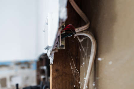 laundry room renovation with plaser walls interior exposed with visible electricity wires, concept...