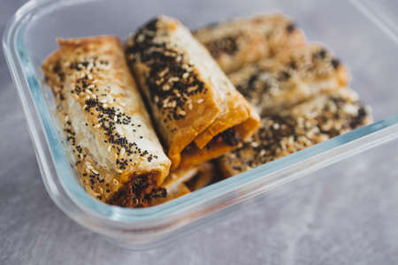 vegan sausage rolls with beans and mixed veggies with seeds topping, healthy plant-based food...