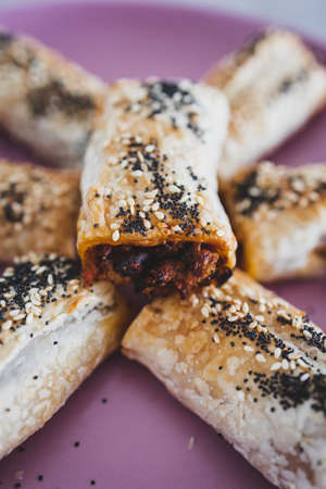 vegan sausage rolls with beans and mixed veggies with seeds topping, healthy plant-based food recipesの写真素材