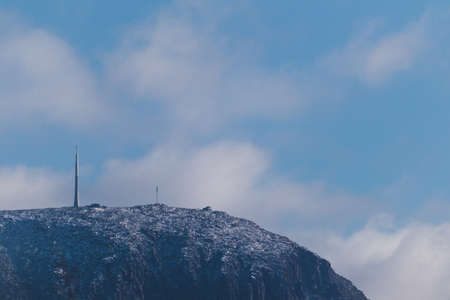 snow on mountain tops in Tasmania, Australia shot with telephoto lens on a sunny winter dayの写真素材