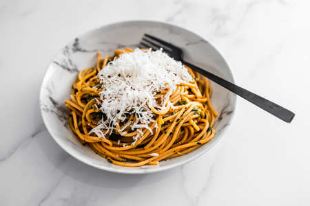 vegan wholemeal spaghetti with dairy-free grated feta topping, healthy plant-based food recipesの写真素材