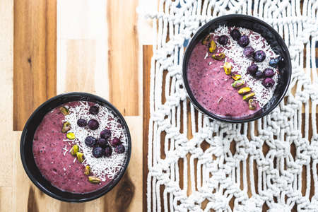 vegan acai blueberries coconut smoothie bowl, healthy plant-based food recipes