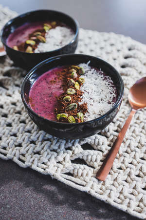 vegan acai pistachio coconut smoothie bowl, healthy plant-based food recipes for summerの写真素材
