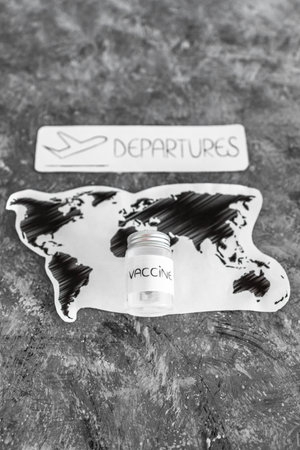 international travel after the covid-19 pandemic conceptual image, world map with vaccine and...
