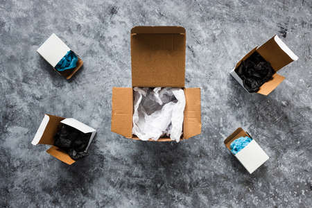 online delivery parcel boxes on grey background, concept of competitions and customer choicesの写真素材
