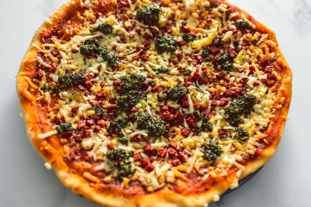 vegan pizza with plant-based bacon pesto and dairy-free cheese, healthy plant-based food recipesの写真素材