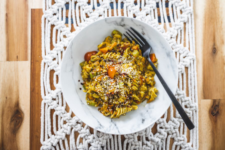 vegan pasta with carrots celeri and fresh pesto sauce, healthy plant-based food recipesの写真素材